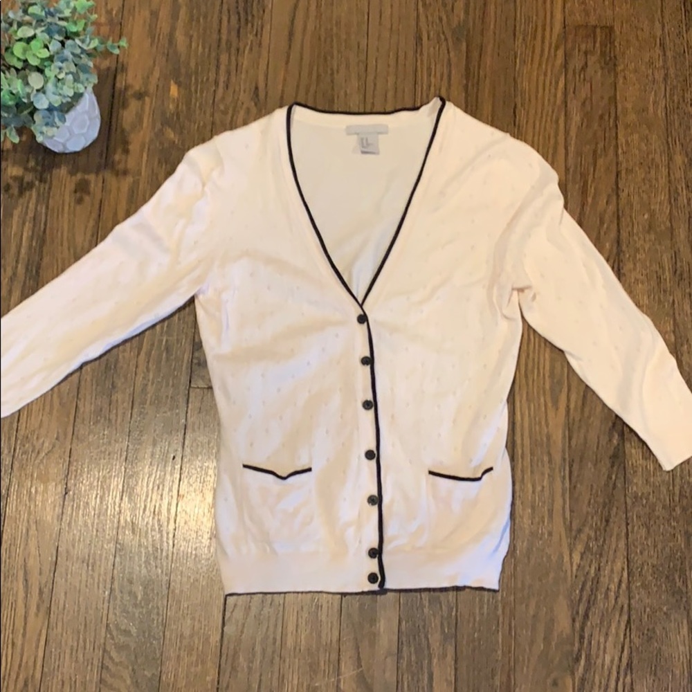 Cream sweater with black trim